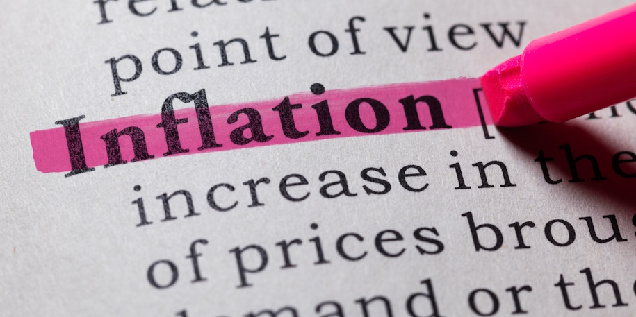 a pink highlighter highlighting inflation in a dictionary