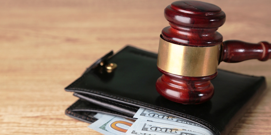 gavel on wallet with money