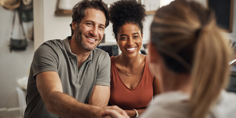 relieved couple talking to lawyer