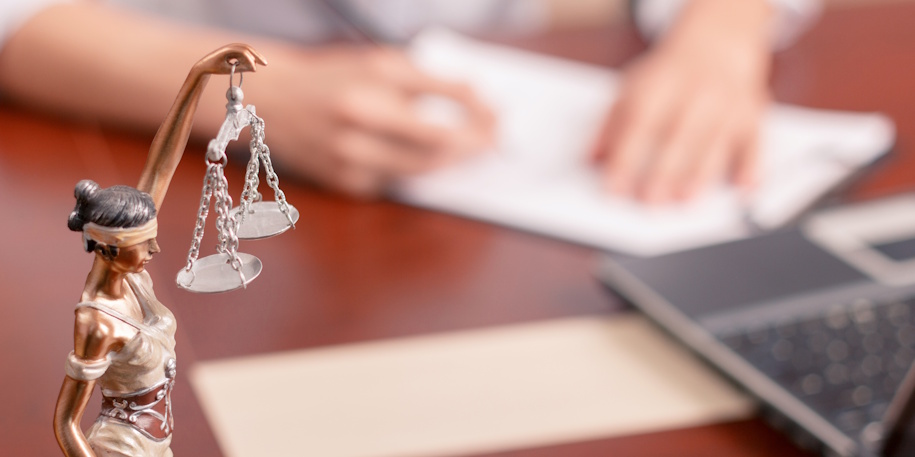 lady justice on lawyers desk