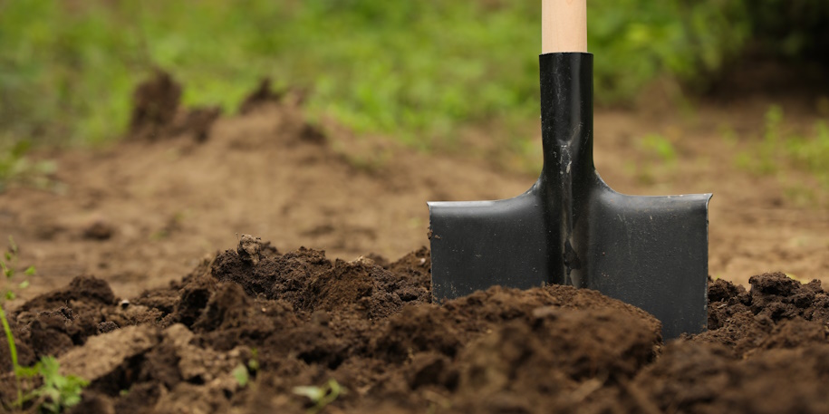 shovel planted in fresh dirt