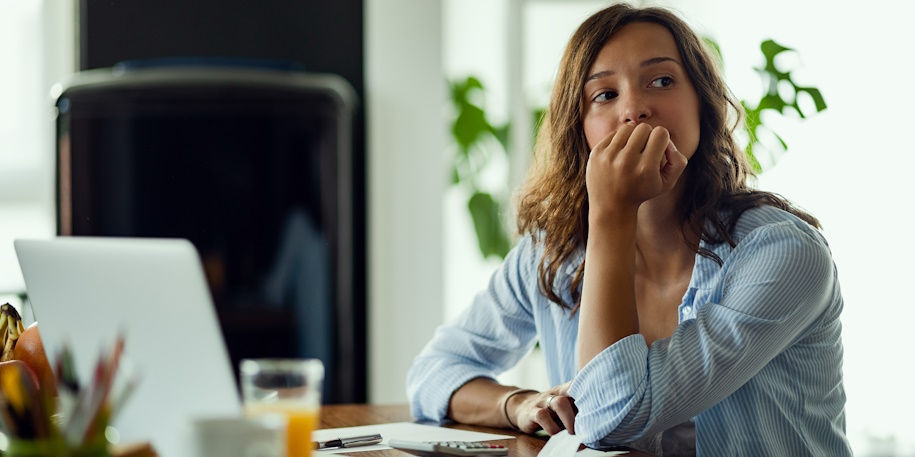 woman worried reviewing finances